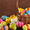 Many painted easter eggs with easter basket