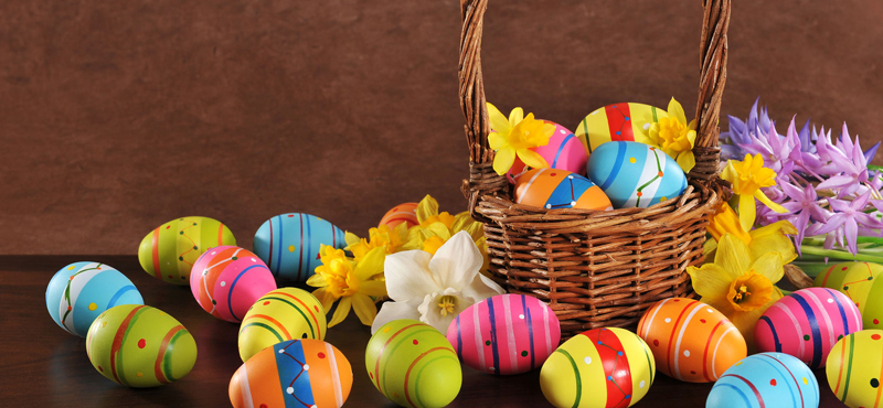 Many painted easter eggs with easter basket