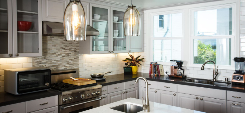 Interior of the remodelled kitchen with appliances in white background